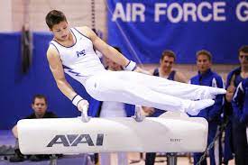 tall gymnast on pommel horse